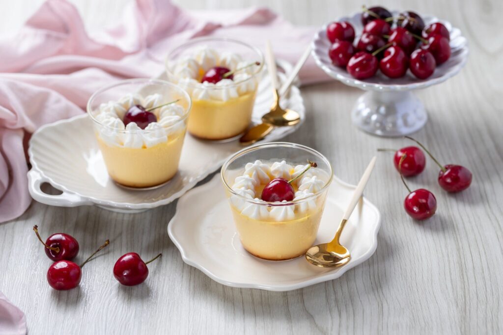 Flan with whipped cream and cherry